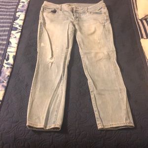 Distressed light blue jeans